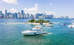 The Azimut Yacht Flybridge 55ft in Miami. The yacht next to the one of the Miami Beach Islands and beautiful view of the downtown Miami on the background. The Image of the boat for rental for Miami Boats Rental website
