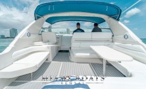 The Aft Deck of the 42' Sea Ray Yacht. White leather seats and table.