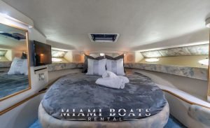 Bedroom of the 42' Sea Ray Yacht. Round-shaped bed and pillows.