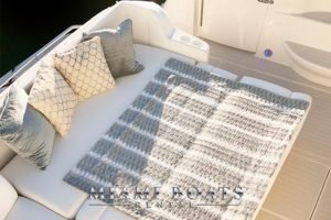 Couch transformed into the bed on the aft deck of the 50' Sea Ray yacht.