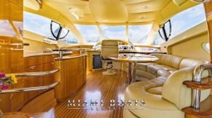 Main salon of the 55' Azimut yacht. Wooden floor and cabinets.