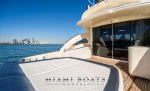 The back of the 70' Gianetti luxury yacht with Miami Downtown on the horizon.