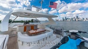 Flybridge of the 75' Aicon Luxury yacht with Miami Downtown on the background.