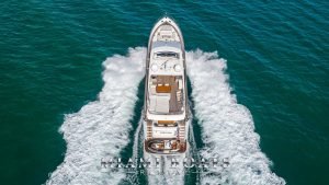 88' Princess luxury yacht speeding across Atlantic Ocean. View from the top.