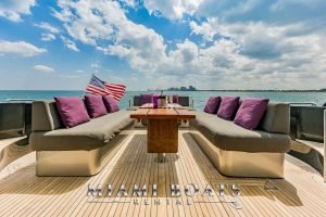Aft deck and American flag of the 92' Mangusta luxury yacht.