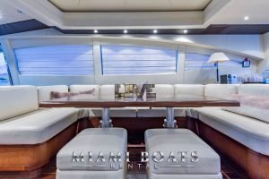 Leather couch and table inside the 92' Mangusta Luxury yacht.