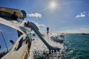 Inflatable Freestyle slide going out to the ocean from the 103 ft Azimut Luxury Yacht.