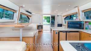 The image made from the kitchen area of the yacht shown the cabin and wide space of Meridian yacht