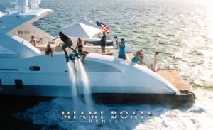 The image of group of people having a good time on a luxury yacht 120' Tecnomar in Miami.