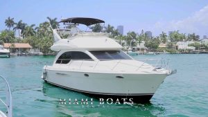 Image of the flybridge yacht 41 feet Meridian on the water in Miami. The yacht listed for rental by Miami Boats Rental