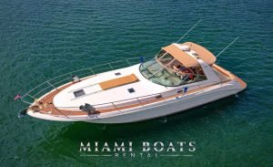 44 ft Sea Ray Harmony. The Sea Ray Sundancer has the sunmat on a bow of the boat. The boat Sea Ray on the water in Miami