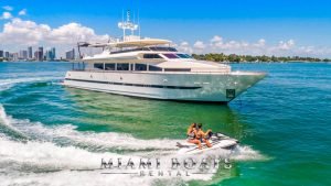 110 Hoizon Luxury Yacht in Miami. Couple riding JetSki in the front.