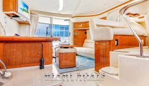 Living room of the 46 ft Sea Ray yacht. Wooden interiors, white floor.