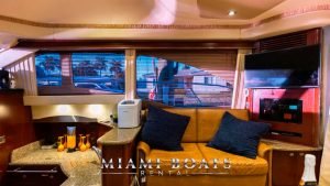 The rest area in the living room of the 47' Sea Ray yacht. Couch with pillows.