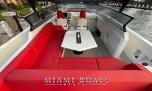 Red sofa and white table on the Aft deck of the 50 ft Vanquish sport yacht.
