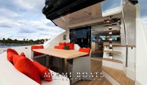 Aft area of Luxury Yacht 80' Numarine Adonis. The dining table at the back of the luxury yacht with designed table and four chairs.
