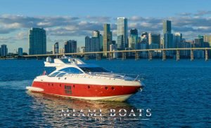 Azimut Yacht Sport 86ft is a luxury yacht in Miami. The Azimut yacht on the water in the sunset time and at the background beautiful view of Downtown Miami