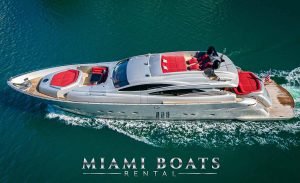 Pershing 90' Luxury Yacht Rental in Miami, FL - The silver super yacht Pershing 90 ft express with an incredible exterior design of red cushions an exotic way to enjoy your yacht charter in Miami