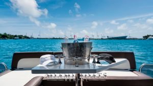 Champagne with glasses in a bucket on the table. Aft deck of the 53' Galeon luxury yacht.