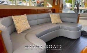 the sofa of the Boat. The living room of Viking Yacht Princess. Grey Sofa with Beige color two pillows