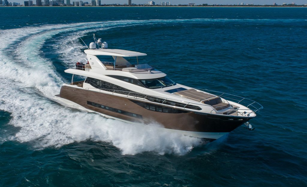 The beautiful modern yacht by Prestige Yachts is available for a yacht charter in Miami, FL. The vessel drifts in the ocean of Miami. The yacht is 75 ft and fantastically designed in brown and white colors.