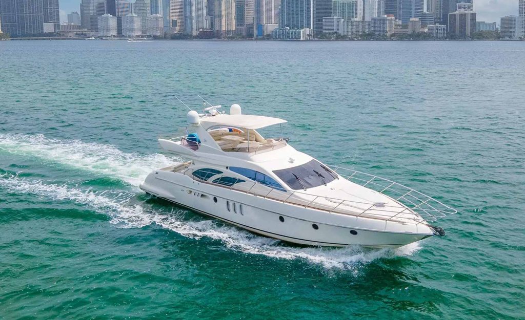 Azimut Yacht Flybridge in Miami Florida, driving in the ocean. 65 ft Azimut Yacht Luxury Vessel listed for charter with Miami Boats Rental