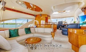 Azimut Yacht 65ft Flybridge Victoria Miami Driving on the Water Luxury Yacht Living Room area where is nice couch with green pillows