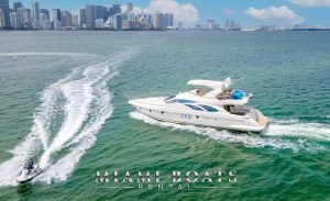 Azimut Yacht 65ft Flybridge Victoria in Miami Water. Luxury Yacht image with Downtown Miami view and Jet Ski driving around the boat