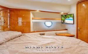 Yacht Stateroom with the bed and tv of Azimut Yacht 65ft Flybridge Victoria