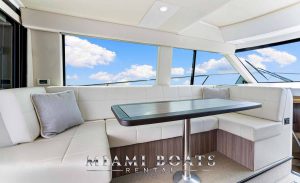 The 42' Regal Yacht Fly showcasing its stylish interior with comfortable seating and state-of-the-art amenities, perfect for entertaining guests.