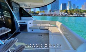 A view of Miami from 42' Regal Yacht Fly's aft deck, complete with comfortable seating, and easy access to the swim platform.