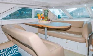 the dining table in living room of the Sea Ray Yacht Flybridge