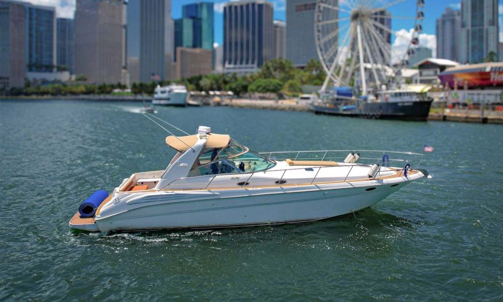 44' Sea Ray Sundancer Yacht Harmony sailing in Miami Biscayne on the water.