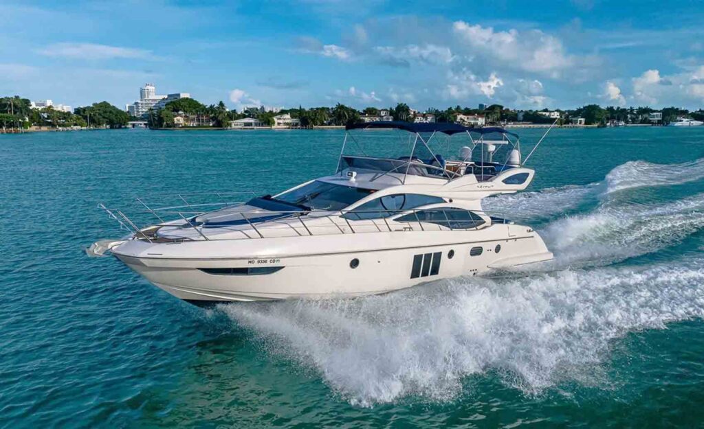 Miami Boats Rental's Yacht Azimut Flybridge in Miami sailing on the water at the beautiful day.