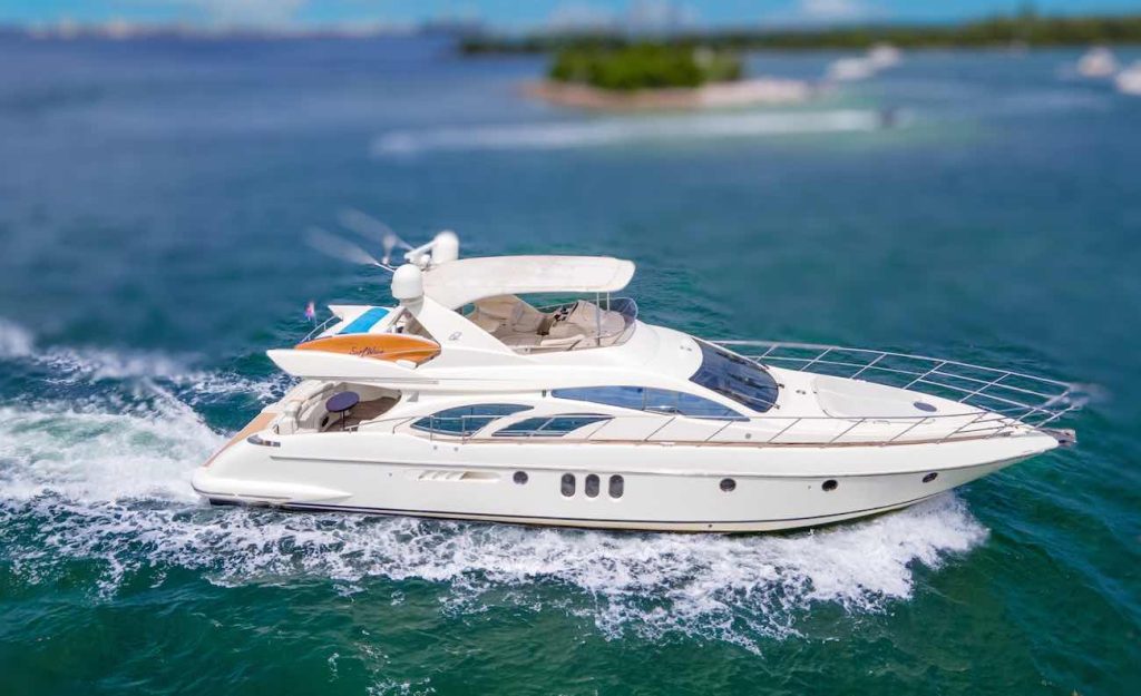 Azimut 65ft yacht named "Victoria" cruising in the waters of Miami.