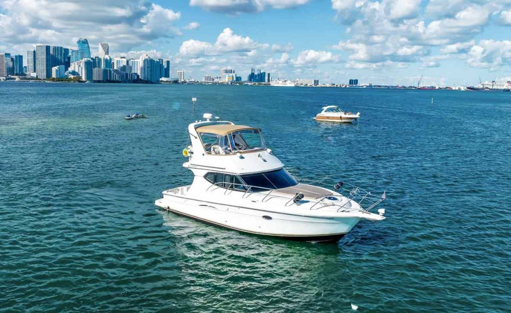 45 foot Flybridge boat at Miami bay with beautiful Downtown Miami view, available for yacht charter