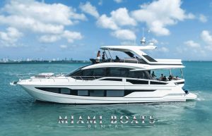 68’ Galeon Yacht ‘Seven Seas’ gliding across Biscayne Bay with guests on board, sunny sky and coastline. Miami Boats Rental logo at the bottom