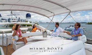 Group of friends in the flybridge of 74' Sunseeker Yacht in Miami
