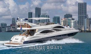 74' Sunseeker Yacht in Miami driving fast on the water.