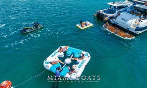 Group of people in the inflatable pool during the yacht charter in Miami on 74' Sunseeker