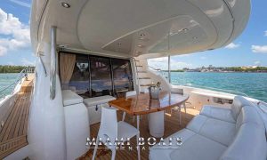 The aft deck of the Sunseeker luxury yacht with dining table and sitting area