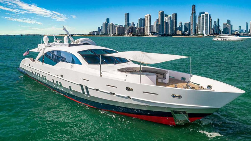 120 foot Yacht Tecnomar Doubleshot - the yacht on the water in Miami with Downtown Miami on the background